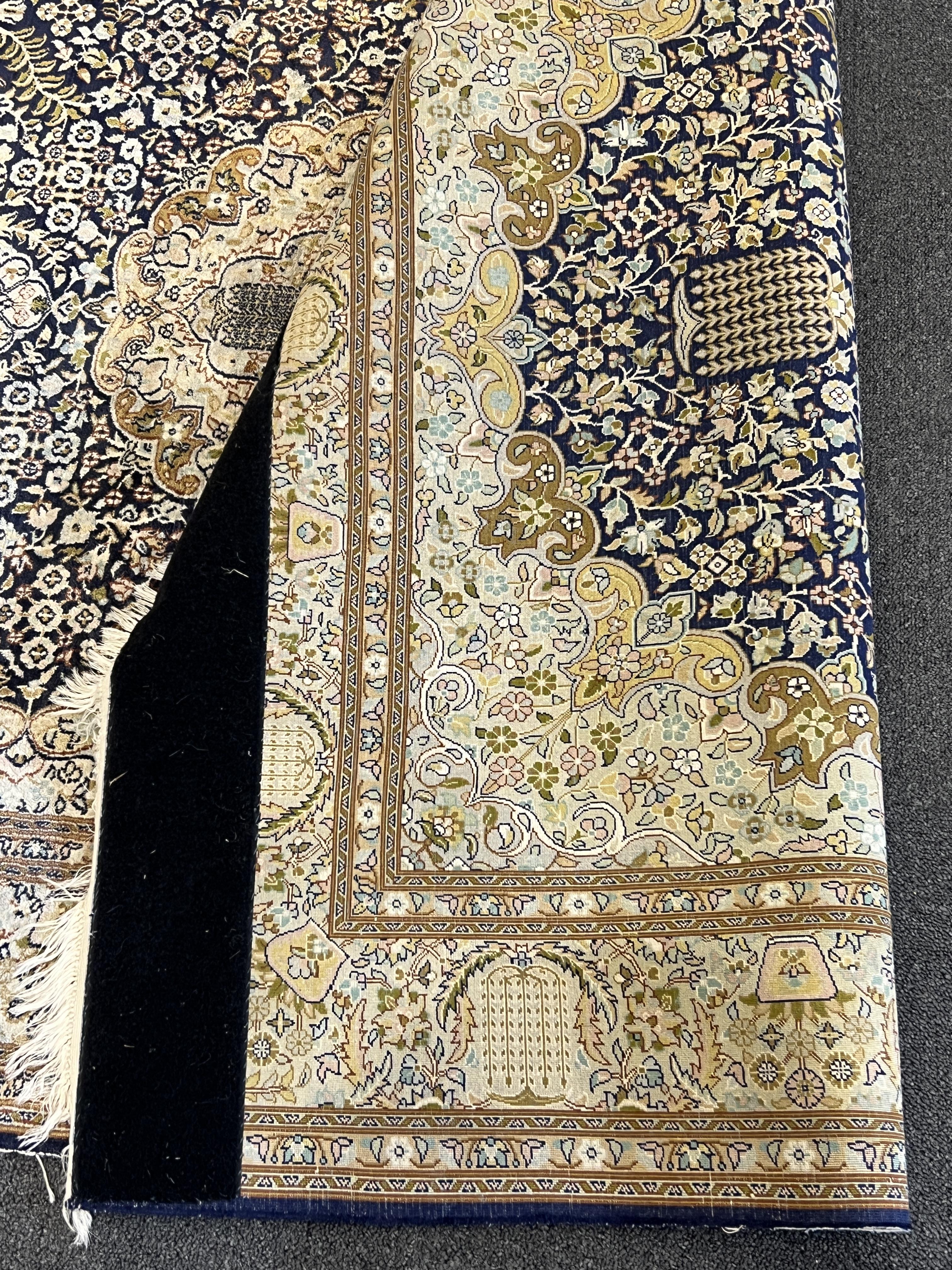 A Persian silk rug, 180 x 120cm